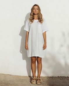 Easy breezy. That is the feeling you get when wearing a linen T-Shirt dress MIJAS in White. Perfectly balanced for summer strolls – it keeps you cool and protects your skin from s. Easy to style – wear it alone with sandals or sneakers, on a colder day – pair it with l linen pants.• T-shirt style dress • 2 side seam pockets, 1 front pocket • Medium weight linen (approx. 180 gsm) Relaxed Dresses For Spring Day Out, Relaxed Dresses For A Spring Day Out, Relaxed Dresses For Day Out In Spring, Relaxed Fit Dress For Day Out, Beach Linen Dress With Relaxed Fit, Casual Linen Dress For Day Out, Relaxed Summer Dresses For Day Out, Relaxed Fit Dresses For Vacation, Casual Short Sleeve Linen Dress For Daywear