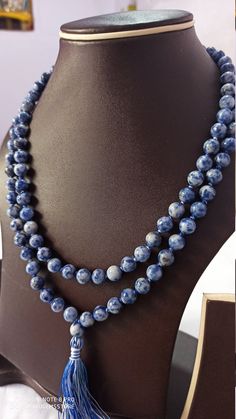 108 Beads// Natural Sodalite Japa Mala Prayer Beads semi-precious Gemstone Sad Sodalite Round Beads // Long Tassel Necklace// Meditation japa mala // Guru bead// Necklace Yoga Beads sad blue Color // 8 mm Bids size - 8mm It is known as the 'love stone' as the message it emits is the strong vibration of unconditional love, joy, warmth and healing. As quartz crystals are profound amplifiers of energy, it may help to kindle happiness, love, romantic feelings and sensuality. It is good for people in Handmade Sodalite Round Bead Necklaces, Handmade Sodalite Round Beads Necklace, Sodalite Gemstone Beads Necklaces, Spiritual Lapis Lazuli Round Beads, Healing Lapis Lazuli Beaded Necklaces, Faceted Beads For Meditation, Jaap Mala, Romantic Feelings, Yoga Beads