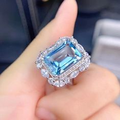 Welcome to Elegant Art Jewelry!  Stone: Natural Blue Topaz Stone Size:. 10mm×14mm Stone Cut:. emerald Cut Side Stone: Zirconia Metal: 925 Sterling Silver Personalization: 9K/14K/24K/GOLD/SILVER/PLATINUM/ROSE-GOLD/WHITE GOLD. (Contact me)  Topaz Ring, Topaz Cuff Ring, 925 Sterling Silver Ring, Oval Shape Ring, Topaz Ring, Topaz Engagement, Open Design Ring, Topaz Oval, Topaz Natural, Blue Topaz, Blue Gemstone, Gemstone Ring, Engagement Ring, Wedding Ring, Statement Ring, Topaz Ring, Victorian Rin Emerald Cut Halo Ring, Pink Topaz Ring, December Birthstone Ring, Gold Topaz, Platinum Rose Gold, Emerald Cut Rings, Topaz Engagement Ring, Cuff Ring, Blue Topaz Stone