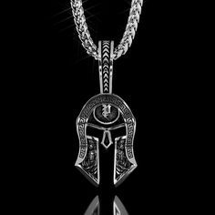 This half polished and half battle-worn Spartan Helmet is a symbol of Strength, Courage, Loyalty, and Power. The Silver Spartan Pendant was created for Free Men who demand the most of themselves. our Men's silver Spartan Pendant is designed, sculpted and handcrafted in the USA. Silver weight is 20. The Helmet itself measures 32mm (1.25 inches) in length and 21mm (0.82 inches) in width. The overall length, including the bail (Crest of the Helmet), is 52mm (2 inches). *Other sizes available upon r Mens Silver Pendants, Pendants For Men, Unique Mens Rings, Spartan Helmet, Symbol Of Strength, Wolves Pendants, Power Symbol, Dragon Ring, Head Ring