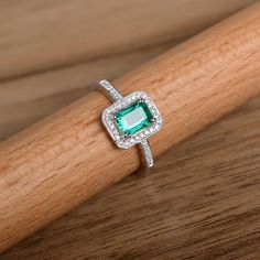 This is a lab emerald ring. The main stone is about 5mm*7mm emerald cut, weight about 0.85 carats.The basic metal is sterling silver and plated with rhodium.To change the metal to a solid gold (white/rose) or platinum is also available, please ask for a quotation if you want.You can also go to my shop Home for more elegant rings: https://www.etsy.com/shop/godjewelry?ref=hdr_shop_menuEmerald is May birthstone.More emerald rings:https://www.etsy.com/shop/godjewelry?ref=hdr_shop_menu&section_id Emerald Ring Silver, Elegant Rings, Emerald Band, May Birthstone Rings, Emerald Rings, Emerald Gem, Ring Emerald, May Birthstone, Green Gems