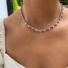 AAA quality clear white cubic zirconia round stones with tarnish resistant high-quality rhodium plated metal setting tennis necklace. Elegant and super flawless sparkling. Three sizes: 15, 16 or 17 inches. Longer size available. Please inquire. Matching bracelet https://www.etsy.com/listing/183062618/bridal-gift-wedding-bridesmaid-bracelet?ref=shop_home_active_9&pro=1&frs=1 Free US shipping Returns and exchange details Customer Satisfaction Guarantee: Below policy will replace standard ETSY poli Silver Cubic Zirconia Tennis Choker Necklace, Silver Tennis Necklace Choker For Party, Silver Tennis Choker Necklace For Party, Silver Choker Tennis Necklace For Party, Collar Necklace Choker, Women Choker Necklace, Choker Collar Necklace, Womens Chokers, Necklace Elegant