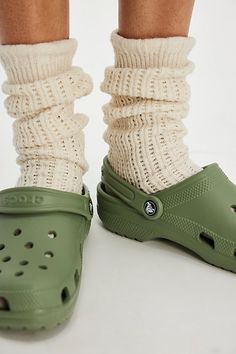 A cult classic, these effortless slip-on clogs from Crocs are featured in their instantly recognizable silhouette with a perforated upper, water-friendly design, and pivoting heel strap. **Features:** Slip-on style, lightweight, water-friendly and buoyant uppers, ventilation ports, pivoting heel strap, textured footbed, tread outsole **Why We | Crocs Classic Clogs at Free People in Green, Size: US 8 Croc Shoes Outfit, Heel Crocs, Crocs Outfit, Crocs Clog, Crocs Clogs, Crocs Classic Clogs, Friendly Design, Crocs Shoes, Strap Heels