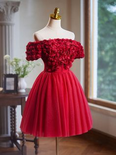 Elevate your style with our Off the Shoulder Flower Bodice Tulle Short Homecoming Dress. The flower bodice adds a touch of elegance, while the tulle fabric creates a flattering silhouette. Perfect for any formal event, this dress will make you feel confident and beautiful. Fitted Bodice Dress With Floral Applique For Banquet, Formal Tulle Dress With Floral Applique, Tulle Evening Dress With Floral Applique And Fitted Bodice, Elegant Tulle Tutu Dress With Floral Applique, Prom Season Tulle Dress With Floral Applique, Tulle Dress With Floral Applique For Prom, Floral Applique Tulle Dress For Prom, Floral Applique Tulle Dress For Banquet, Organza Dress With Floral Applique And Fitted Bodice