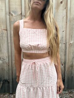 Cute and comfy to the max - Dorothy's gingham set is a style must-have! The top's thick straps, square neckline and cut-out provide a cool, vintage feel, and the elastic waist and hemline make 'em even more dreamy. The matching maxi skirt is the icing on the cake! Cotton and polyester for the win. (And yes, you do need it!) Square Neck Crop Top For Spring Vacation, Spring Crop Top For Picnic, Spring Picnic Cropped Top, Spring Gingham Top With Square Neck, Gingham Square Neck Top For Spring, Casual Gingham Crop Top For Spring, Casual Gingham Cotton Crop Top, Spring Gingham Square Neck Top, Plaid Cotton Crop Top For Spring