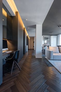 a living room filled with furniture and a wooden floor