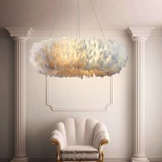 a white chair sitting under a chandelier in a room