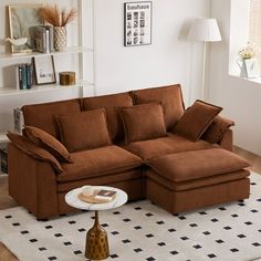 a living room with a sectional couch and coffee table