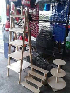 several wooden shelves and stools in a garage