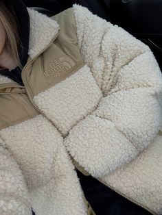 The North Face sherpa nuptse jacket , fleece, outfit, streetwear, puffer jacket. Fluffy Jackets For Women, Cute Puffy Sweaters, Nike Sherpa Jacket, Northface Puffer Teddy Jacket, North Face Fur Jacket, Aesthetic Winter Coat, Cozy Winter White Fleece Jacket, Winter Jackets 2023, Vanilla Girl Outfits Winter