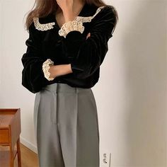 Velvet & Lace Romantic Vintage Style Blouse with long sleeves, buttons through front and lace decorated collar and sleeves. size S Length 62cm bust 92cm shoulder width 37cm size M Length 63cm bust 96cm shoulder width 38cm size L Length 64cm bust 100cm shoulder width 39cm size XL Length 65cm bust 104cm shoulder width 40cm Material: COTTON, Polyester Elegant Black Top With Doll Collar, Elegant Winter Tops With Lace Trim, Elegant Winter Lace Top, Elegant Lace Trim Tops For Winter, Elegant Lace Top For Winter, Long Sleeve Lace Trim Blouse For Work, Workwear Blouse With Lace Long Sleeves, Fall Lace Patchwork Long Sleeve Blouse, Black Long Sleeve Blouse With Lace Cuffs