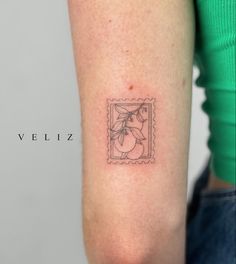 a small tattoo on the arm of a woman