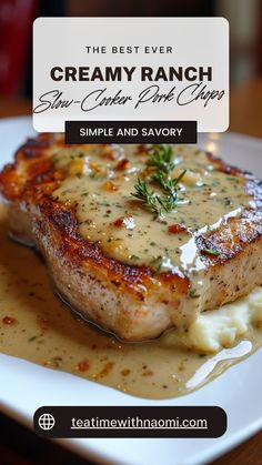 a white plate topped with meat covered in gravy