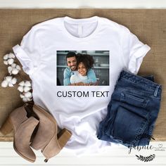 Collaborate with our designers to create your unique and personalized t-shirt. We have over 100s of fonts, graphics, and colors to choose from. You can even send in your own photos! This is a collaborative experience, you will receive mockups along with way for approval. We ask that you have a basic idea of what you want in mind (i.e.- kind of graphics, words, position of text and/or graphics, etc.) but we are willing to collaborate with you along the way to make sure you receive the perfect cus Customizable Short Sleeve T-shirt With Sublimation Design, Custom Graphic Print Sublimation Short Sleeve Shirt, Customizable Crew Neck Sublimation T-shirt With Graphic Print, Customizable Crew Neck Sublimation Design With Graphic Print, Graphic Tee T-shirt With Relaxed Fit As Gift, Relaxed Fit Graphic Tee Gift, Relaxed Fit Graphic Tee For Gift, Custom Text Crew Neck T-shirt For Gift, White T-shirt With Custom Print, Relaxed Fit