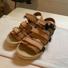 Beige Three-Strap Suicoke Sandals. Never Worn! New In Box. Spring Brown Sport Sandals With Buckle Closure, Brown Sport Sandals With Ankle Strap For Beach, Brown Ankle Strap Sport Sandals For Beach, Brown Sport Sandals With Adjustable Strap For Summer, Brown Casual Sport Sandals With Double Strap, Brown Strapped Sandals For Summer, Brown Sport Sandals With Adjustable Strap For Spring, Spring Brown Sport Sandals With Adjustable Strap, Beige Leather Sandals For Outdoor