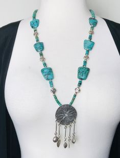 Unique Genuine Turquoise Necklace with Sterling Silver accents.  I collected these stones & silver beads over 15 years ago. Beautiful mottled blue/green in colour.   The Sterling Silver Pendant is from Chiang Mai Artisan Silversmith located in the far North of Thailand.  Perfect as a statement layering piece.  One of a Kind! 💜 Could modify and shorten length on request.💜 Bohemian Turquoise Polished Beads Jewelry, Bohemian Turquoise Beaded Jewelry, Southwestern Silver Turquoise Necklace For Festival, Polished Turquoise Beads Necklace For Festival, Bohemian Sterling Silver Turquoise Necklace With Polished Beads, Bohemian Turquoise Necklace With Polished Sterling Silver Beads, Silver Beaded Turquoise Amulet Necklace, Silver Beaded Amulet Turquoise Necklace, Handmade Silver Turquoise Necklace In Bohemian Style