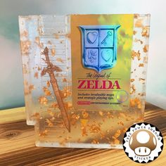 the legend of zelda game is in its plastic case with gold flakes all over it