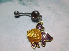 belly button ring yellow and purple fish purple stone stainless steel belly button jewelry 14 gage surgical steel https://www.etsy.com/shop/sindys Purple Fish, Belly Button Piercing Jewelry, Belly Piercing Jewelry, Belly Button Jewelry, Belly Jewelry, Body Jewelry Piercing, Yellow And Purple, Nose Jewelry, Belly Button Ring