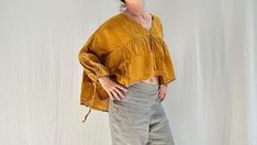 Fall Peasant V-neck Top, Fall Peasant Style V-neck Top, Fall Peasant Cotton Top, Peasant Style Cotton V-neck Top, Cotton Peasant Top V-neck, Cotton Peasant Top With V-neck, V-neck Relaxed Fit Peasant Top For Fall, Smock Top With Short Sleeves For Fall, Relaxed Fit V-neck Peasant Top For Fall