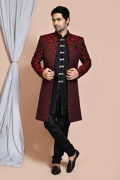 Maroon sherwani jacket with all over geometric pattern. Paired with an inner black kurta and churidar. - Aza Fashions Fitted Kurta With Zari Work And Stand Collar, Designer Festive Kurta With Stand Collar, Festive Designer Kurta With Stand Collar, Designer Stand Collar Kurta For Festive Occasions, Fitted Traditional Wear With Stand Collar For Diwali, Fitted Sherwani With Stand Collar For Diwali, Fitted Stand Collar Traditional Wear For Diwali, Festive Outerwear With Traditional Drape For Reception, Festive Traditional Drape Outerwear For Reception