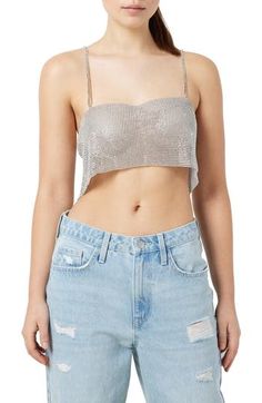 This festival-ready tank is designed in a cropped silhouette and covered in lustrous metallic studs. 6 1/2" center front length (size M/L) Sweetheart neck Sleeveless 50% plastic, 50% polyester Hand wash, line dry Imported Spring Glamorous Crop Top With Rhinestones, Metallic Crop Top For Summer Night Out, Metallic Cropped Tops For Spring, Glamorous Spring Club Tank Top, Fitted Metallic Glamorous Crop Top, Glamorous Fitted Cropped Halter Top, Glamorous Cropped Crop Top With Rhinestones, Metallic Cropped Crop Top For Party Season, Glamorous Cropped Rhinestone Crop Top