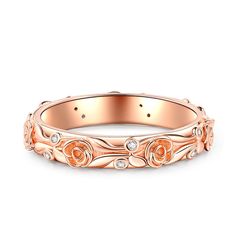 an 18k rose gold wedding band with diamonds