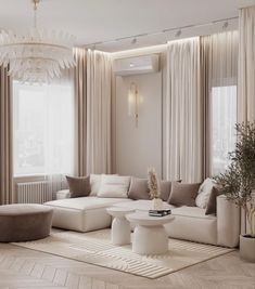 an elegant living room with white furniture and beige drapes on the windowsills