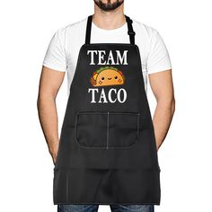 a man wearing an apron that says team taco