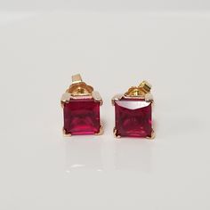 "Thanks for shopping our vintage estate store. We tend to sell well below wholesale and truly hope you enjoy all of our items. Many of the items are one of a kind, so please enjoy scrolling through the pictures and hopefully something will catch your eye. Brown spots are from camera or reflections. Nice estate 10k yellow gold lab created 4ct ruby princess cut studs. Size: 1/4\" 7mm Weight: 2.20 grams Gems: 2ct each Marked 10k and these are nice. Lab created. Backs are 14k." Luxury Lab-created Ruby Earrings For Gift, Classic 14k Stamped Earrings For Anniversary, Classic Prong Setting Earrings Gift, Classic Prong Setting Earrings For Gifts, Classic Earrings With Prong Setting As Gift, High-quality 14k Gold Earrings For Anniversary, Vintage Earrings With Prong Setting, Classic 14k Gold Earrings For Gift, Vintage High Quality Jewelry For Formal Occasions