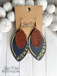 "Genuine Leather Earrings handmade with an embossed football. Genuine Navy Blue Leather with \"Midway\" heat pressed on in gold. S P E C I F I C A T I O N S - Earrings are approximately 3.25\" long and about 1.375\" wide - Ear wire is gold-plated - Each pair comes with 2 rubber earring backs This listing is for one (1) pair of genuine leather layered earrings. **Please note that color may be slightly different due to monitor displays and pattern may be different due to the nature of the cut on the pattern. All earrings are made to order with care, so slight variations may also occur from photo.**" Football Earrings Cricut, Diy Football Earrings, Leather Football Earrings, Sports Earrings, Laser Crafts, Cricut Earrings, Football Jewelry, Diy En Cuir, Layered Earrings