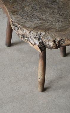 a piece of wood that has been turned into a table with two legs on it