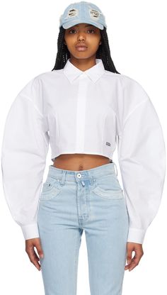 Cotton poplin shirt. · Spread collar · Concealed button closure · Logo printed at front · Cropped hem · Balloon sleeves · Single-button barrel cuffs Supplier color: White Long Sleeve Poplin Tops With Button Closure, Casual Long Sleeve Poplin Top, Collared Poplin Tops With Button Closure, Relaxed Fit Poplin Tops With Button Cuffs, Collared Poplin Top With Button Closure, Spring Collared Shirt With Blouson Sleeves, Spring Cotton Shirt With Blouson Sleeves, Cotton Cropped Shirt With Button Cuffs For Spring, Summer Long Sleeve Poplin Shirt