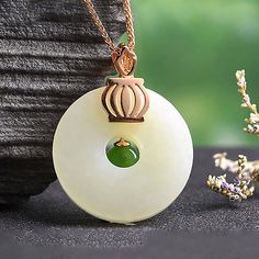 * INTRODUCTION--- Introducing the exquisite Genuine White and Green Nephrite Jade Crown Necklace Pendant a true embodiment of elegance. Crafted with the utmost precision and attention to detail, the pendant features genuine white nephrite jade with a vibrant green jade on top. The pendant comes complete with a crown accent to complement the overall aesthetic. This remarkable piece is not only an exquisite display of nature's finest elements, but it's the ideal choice for special occasions or as Crown Pendant, Crown Necklace, Crown Design, Nephrite Jade, Jade Jewelry, Jade Beads, Traditional Jewelry, Green Jade, Silver Pendant Necklace