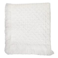 two white pillows with fringes on them