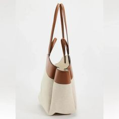 Mixed Tote Bag. Canvas Fabric Exterior. Handles And Shoulder Straps. Magnetic Closure. Height X Length X Width: 19.7 X 12.2 X 5.1 Inches (50 X 31 X 13 Cm) Dark Tan Luxury Beige Canvas Bag With Handles, Luxury Beige Bucket Bag For Errands, White Luxury Canvas Shopping Bag, Luxury White Canvas Shopping Bag, Modern Large Capacity Beige Hobo Bag, Modern Beige Large Capacity Hobo Bag, Luxury Beige Bucket Bag With Large Capacity, Elegant Canvas Bag With Removable Pouch, Chic Satchel Canvas Bag