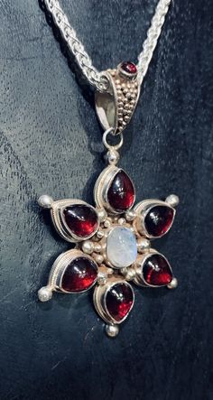 Stunningly beautiful Garnet with a lovely irresistible moonstone in the center! Handmade, fair trade sterling silver. 2” L Random Jewelry, Dr Closet, Edgy Jewelry, Wardrobe Goals, Handmade Fair, Indian Jewelry Sets, Fancy Jewellery, Funky Jewelry, Iron Maiden