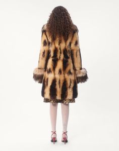 Shearling Coat - Contrasting shearling detail on cuffs and neckline - Front hook-and-eye fastening - Shearling - Habotai lining (100% Silk) - Length: 94 cm / 37 in. from the shoulders in an Italian size 40 - Sleeve length: 78 cm / 30.7 in. from the centre back in an Italian size 40 - The model is 176 cm / 5'9" tall and wears an Italian size 40 - Made in Italy The look of the model is completed by a Valentino Garavani Quiltie 67 Bag and Valentino Garavani Ladycrush Shoes. Fitted Shearling Fur Coat With Faux Fur Lining, Fitted Luxury Fur Coat With Faux Fur Lining, Fitted Designer Fur Coat With Faux Fur Trim, Designer Fitted Fur Coat With Faux Fur Trim, Fitted Brown Sheepskin Fur Coat, Fitted Brown Shearling Fur Coat, Coat For Woman, Studded Sneakers, Oxford Sneakers