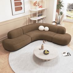 a large sectional couch sitting on top of a white rug