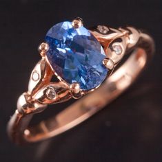 14k Rose Gold Oval Ceylon Blue Sapphire Diamond Leaf Style Ring 1.69ctw 3.08gMetal Information: 14k Rose GoldTotal Weight: 3.08gBand Width: 2.0mmSize: 6.5Stone InformationMain StoneGem Type: SapphireShape: Oval (8.4mm x 5.8mm)Color: Ceylon BlueClarity/Quality: AACarat Weight: 1.65ctNumber of Stones: 1Accent StonesGem Type: DiamondShape: Round (1.3mm)Color: G - HClarity/Quality: SI1Carat Weight: .01ctNumber of Stones: 4Total estimated ctw (carat total weight): 1.69ctwEstimated Retail Price: $3000.00OUR PRICE: $2400.00SizingMany of our pieces can be re-sized at the buyers request. Please email us if you require our skilled professional services.46198F Ceylon Blue Sapphire, Gold Sapphire Ring, Blue Sapphire Diamond, Professional Services, Sapphire Diamond, Diamond Shapes, Sapphire Ring, Blue Sapphire, Jewelry Watches