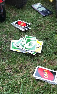 several pieces of stickers laying on the grass