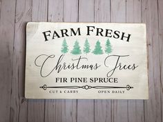 a wooden sign that says farm fresh christmas trees fir pine spruce cut and carry open daily