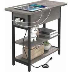 an electronic device is plugged into the charging station on top of a small table