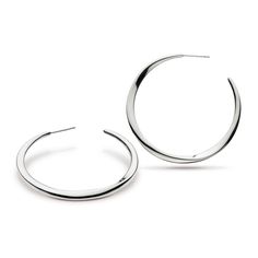 These sterling silver hoop earrings measure 45mm. Solid in design they hang elegantly with faceted curves to draw the light at all angles. These contemporary earrings are simply timeless. Modern Hoop Earrings With Shiny Finish, Modern Shiny Hoop Earrings, Modern White Gold Hoop Earrings With Shiny Finish, Modern Sterling Silver Round Hoop Earrings, Modern Small Hoop Earrings, Modern Polished Hoop Earrings, Contemporary Sterling Silver Hoop Earrings, Modern Sterling Silver Hoop Earrings, Modern Curved Jewelry