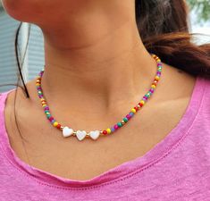 Multicolor Beaded Choker necklace  Beautiful delicate necklace great to wear on summertime, festival, party, vacation, holiday, banquet, beach or everyday wear. ▪️These cute necklaces are made with 3mm multicolor glass beads, 18k gold brass spacer beads, nylon cord 0.5mm, Shell. ▪️ Size: 17 inches long. ▪️All orders go inside a box already prepared as a gift. ▪️100% handmade items. ▪️It is not recommended to contact the jewelry with soap, lotions, perfume or any other harmful chemicals to use it Heart Shaped Necklaces For Summer Gifts, Heart-shaped Summer Necklaces Perfect As Gifts, Colorful Heart Beads Necklace For Beach, Colorful Heart Beads Necklaces For Festivals, Colorful Heart Beads Necklace For Festivals, Multicolor Heart Beads Jewelry For Vacation, Summer Heart Beads Beaded Necklaces, Colorful Festival Necklaces With Heart Beads, Trendy Heart-shaped Summer Necklace