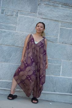 Handmade Rayon Jumpsuit | Handmade in Nepal - One Size Jumpsuit Summer Fashion 2022 - Boho Hippie Jumpsuit Sleeveless Tie Dye Abstract Lengths -Chest up to 42" -Hip max 42" -Length without strap 43" -Length from top to the longest part (middle) 46" -Length from shoulder to crotch 43" -Leg Circumference is Open ** Abstract Jumpers do not Include Pockets  *Model Height is 5'2* Return Policy: If you are not satisfied with your item, you must return your item in 7 days. After 7 days, there will be n Casual Sleeveless Jumpsuits And Rompers For Festival, Bohemian Sleeveless Jumpsuits And Rompers For Loungewear, Purple Sleeveless Loungewear Dress, Purple Sleeveless Dress For Loungewear, Sleeveless Purple Dress For Loungewear, Purple Sleeveless Lounge Dress, Purple Sleeveless Jumpsuit For Vacation, Purple Jumpsuits And Rompers For Summer Beach, Purple Jumpsuits And Rompers For Beach In Summer