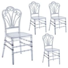 three white chairs with clear plastic seats