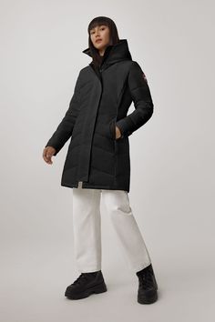 One of our most-loved styles, the Lorette Parka, gets an update with streamlined hood details, elevated trims, and additional inside pockets. Conquer fluctuating temperatures in this sophisticated parka with elaborate quilt-through detailing. Customize your parka and extend the coverage of your hood with a variety of our interchangeable Hood Trim accessories. Men Parka, Heavy Jacket, Baby Outerwear, Mens Parka, Womens Parka, Snow Pants, Boots And Sneakers, Waist Pack, Black Label