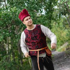 "15th century! Based on historical sources! A timeless piece of late medieval fashion, this patterned waistcoat captures the essence of an era gone by. It features a front closure with buttons, exuding an authentic medieval charm. Visit our shop on Etsy: https://www.etsy.com/pl/shop/SPESMedievalMarket  📝Key Features  ◾ Century: 15th and later  ◾ Material: brocade and linen; tin buttons. ◾ Pattern: Venetian dragons and phoenixes from \"Kunstgeschichte der Seidenweberei\" by Otto von Falke. ◾ Per Patterned Waistcoat, Victorian Vest, 14th Century Clothing, Viking Hat, Wool Waistcoat, Tweed Waistcoat, Medieval Costume, Vintage Vest, Century Clothing