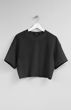 Color: BlackFabric: 65% Rayon, 30% Nylon, 5% SpandexCare: Machine Wash Cold/ Tumble Dry Low Raw-edge dense jersey tee. 18.5' (47cm) long. Made in USA. Tee Shirt Oversize, Cropped Tees, Oversized Crop Top, Trendy Shirt Designs, Black Shirts, Fashion Top Outfits, Crop Top Casual, Black Crop Top, Easy Trendy Outfits