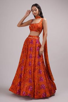 Pink, orange attached cancan lehenga with floral print and sequin work on waistband. Paired with embroidered padded blouse and dupatta. - Aza Fashions Designer Orange Silk Lehenga, Designer Wear Orange Silk Lehenga, Orange Silk Lehenga For Designer Wear, Silk Lehenga With Resham Embroidery In Orange, Orange Silk Lehenga With Resham Embroidery, Orange Silk Dupatta For Reception, Orange Sets For Reception And Festivals, Semi-stitched Silk Orange Lehenga, Orange Silk Semi-stitched Lehenga